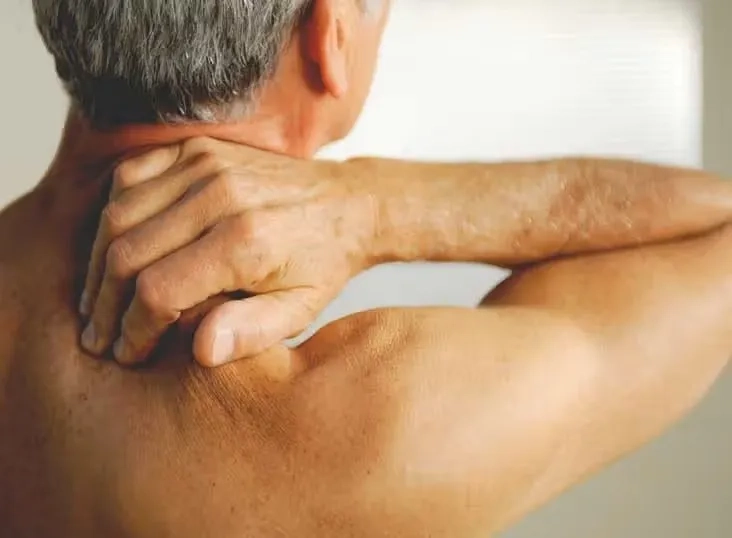 A patient undergoing physical therapy for fibromyalgia treatment