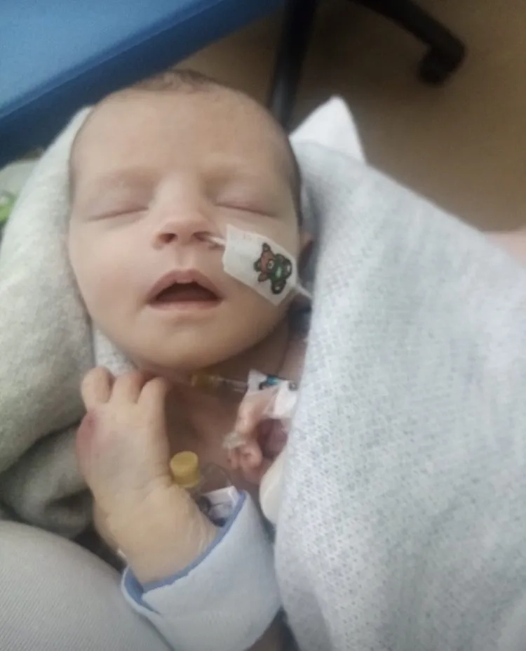 A photo of a heel prick for newborn screening